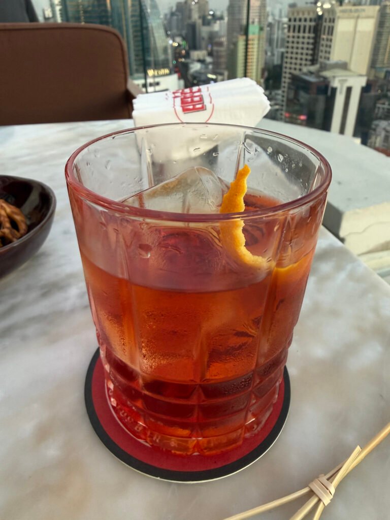 Classic Negroni Cocktail with Orange Peel at Belga Bangkok